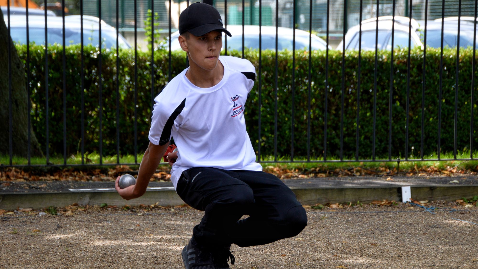 Pétanque player throwing a boule